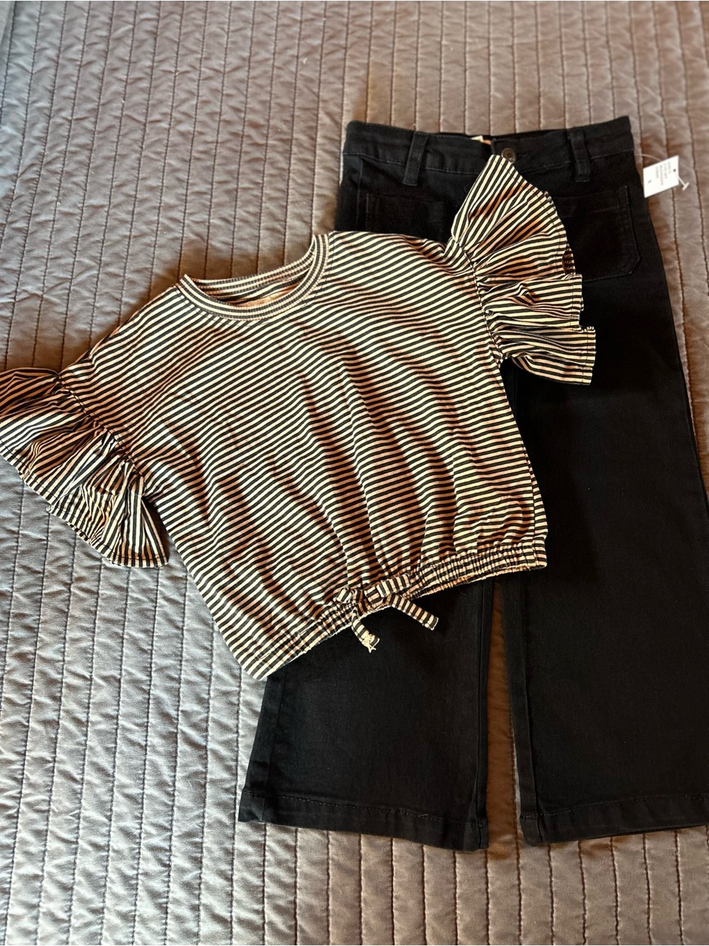 Jessica Simpson Black & Cream Striped Knit Top & black jeans